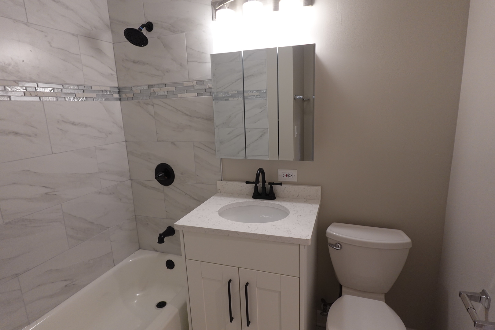 613 South Oltendorf Road Streamwood, IL 60107 - Photo 20 of 37 a bathroom with a sink a toilet and shower