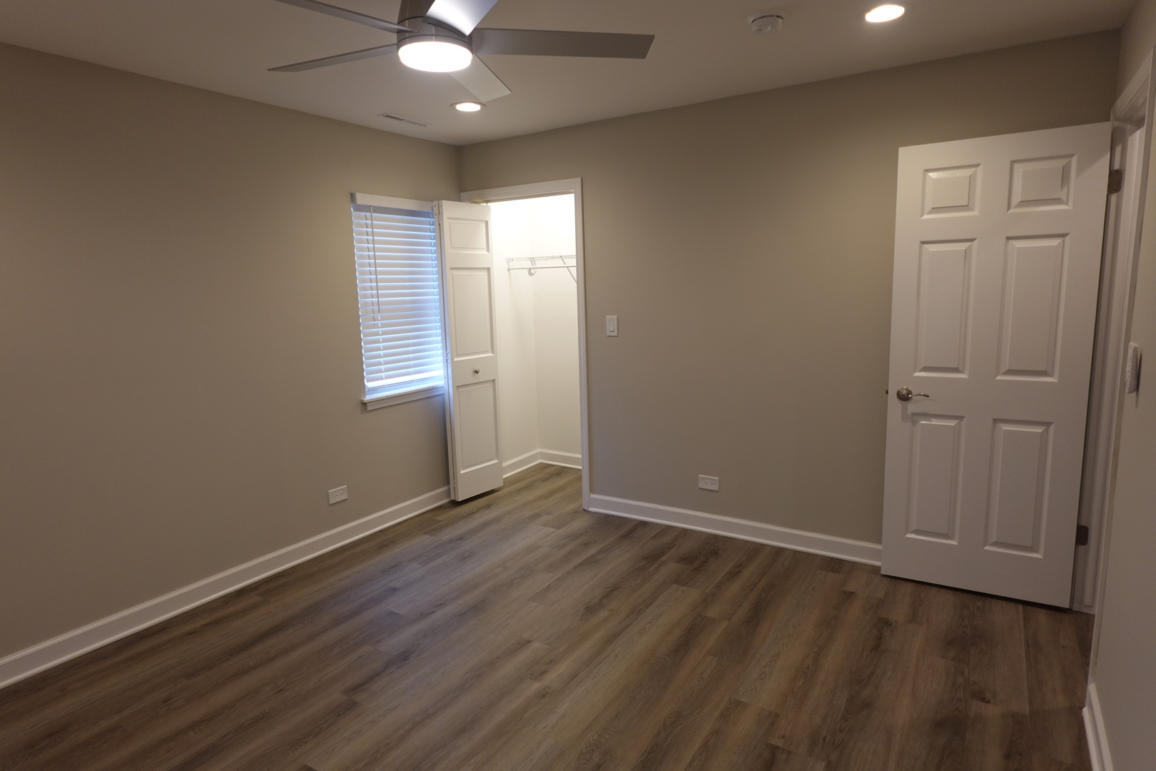 613 South Oltendorf Road Streamwood, IL 60107 - Photo 22 of 37 an empty room with wooden floor and windows