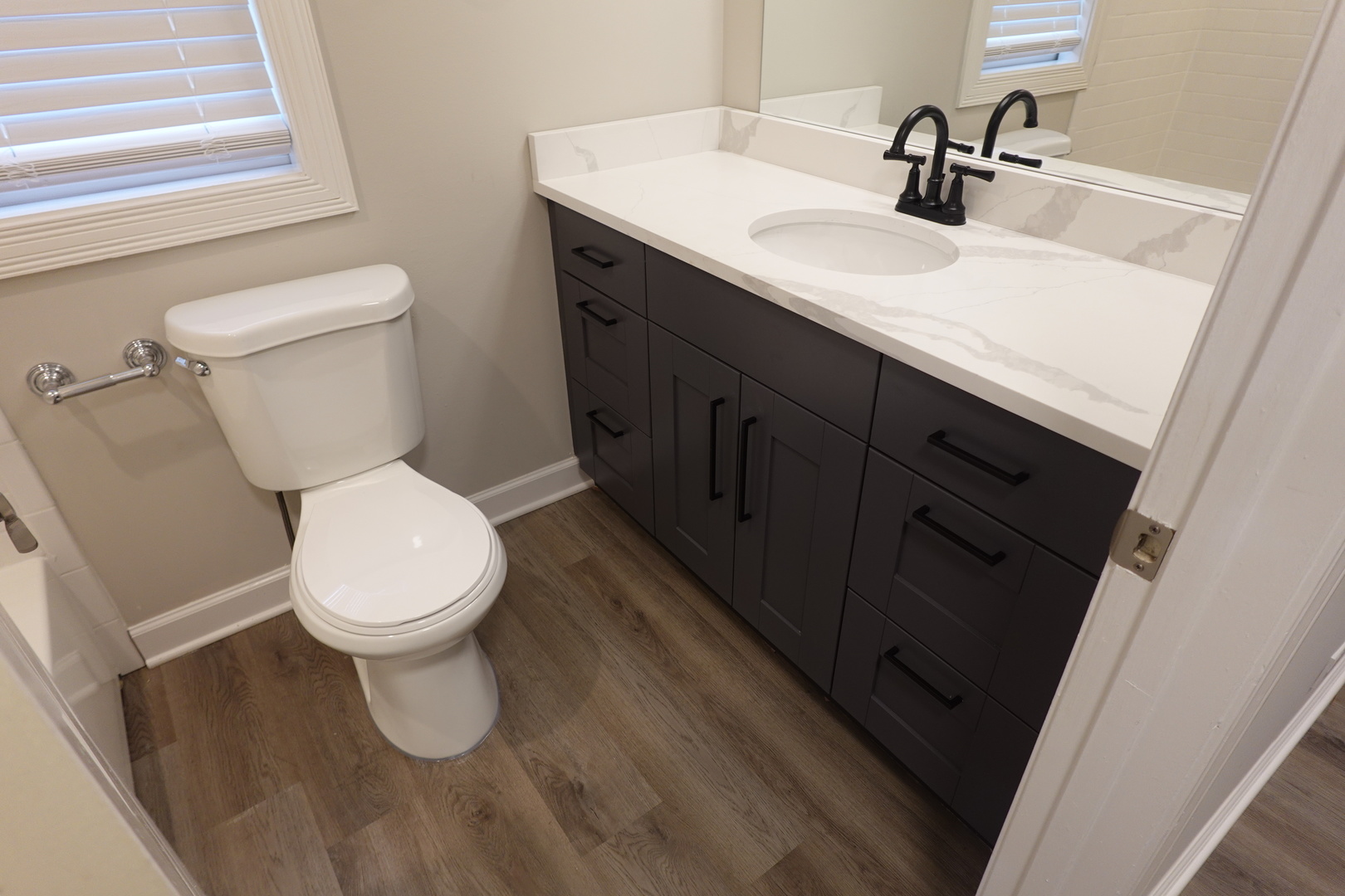 613 South Oltendorf Road Streamwood, IL 60107 - Photo 23 of 37 a white toilet sitting next to a bathroom sink