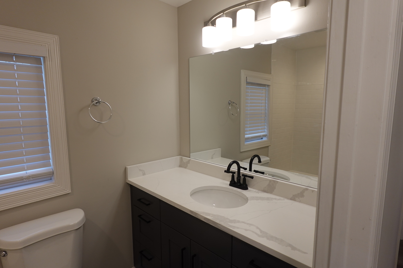 613 South Oltendorf Road Streamwood, IL 60107 - Photo 24 of 37 a bathroom with a sink and a mirror