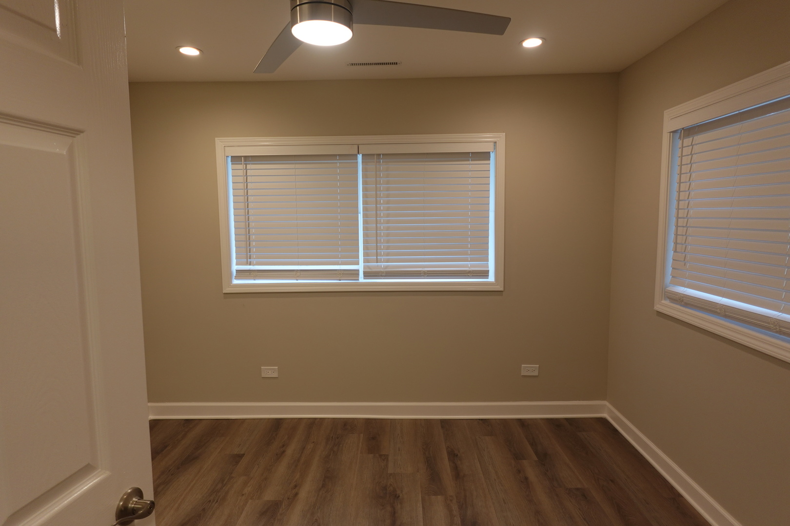 613 South Oltendorf Road Streamwood, IL 60107 - Photo 26 of 37 an empty room with wooden floor and windows