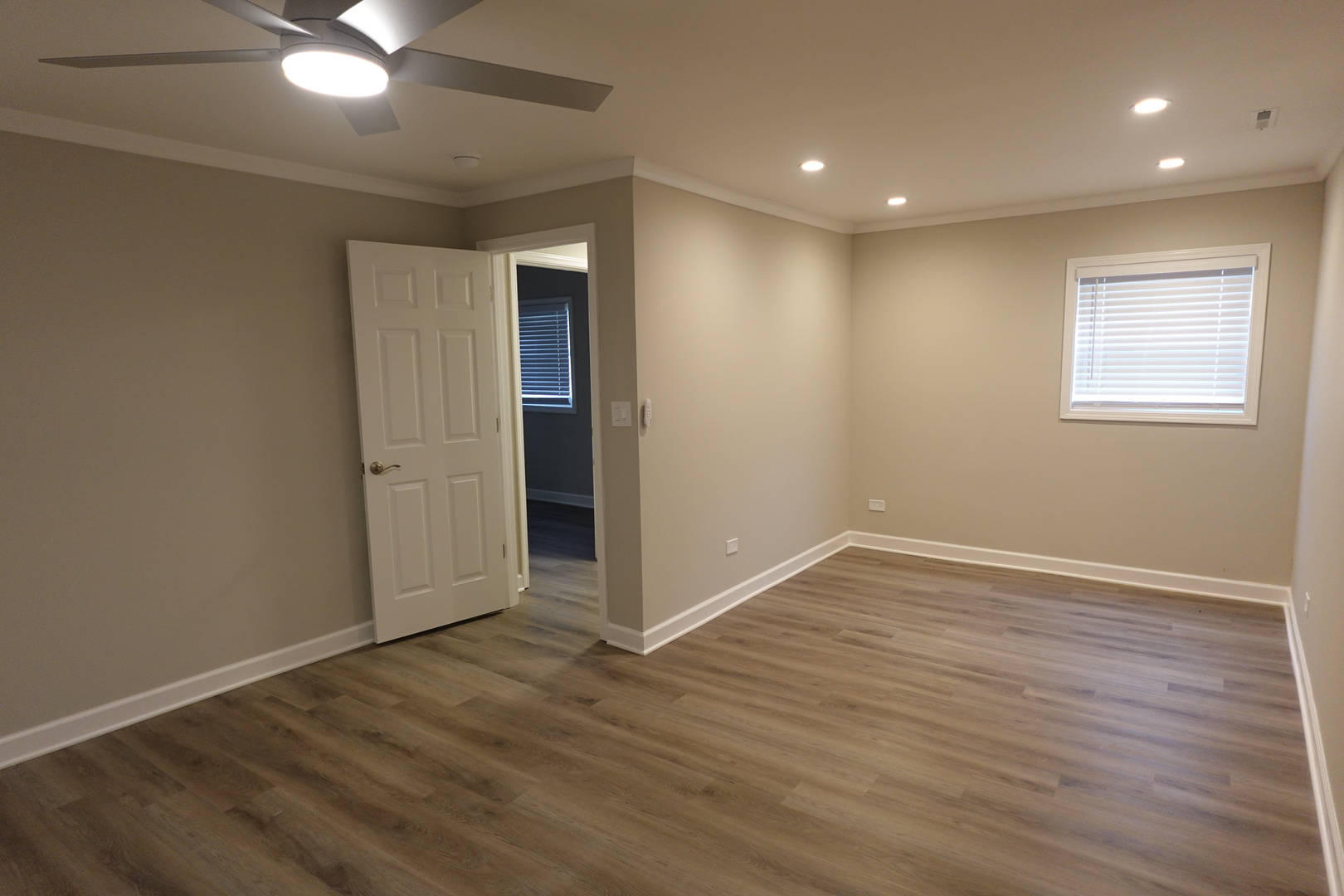 613 South Oltendorf Road Streamwood, IL 60107 - Photo 28 of 37 a view of an empty room with wooden floor and a window