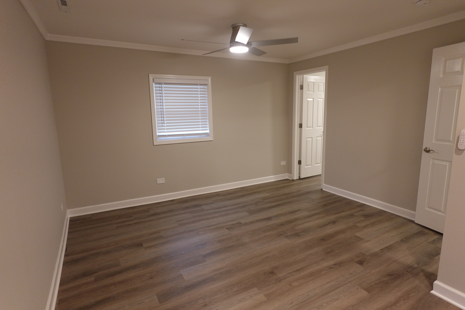 613 South Oltendorf Road Streamwood, IL 60107 - Photo 30 of 37 a view of an empty room with wooden floor closet and a window