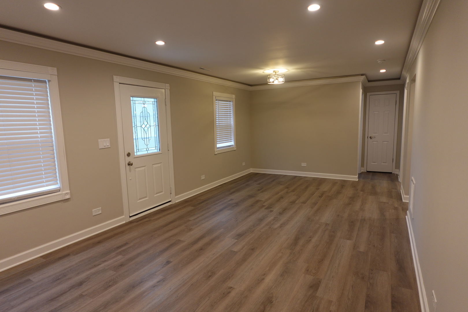 613 South Oltendorf Road Streamwood, IL 60107 - Photo 8 of 37 an empty room with wooden floor and windows