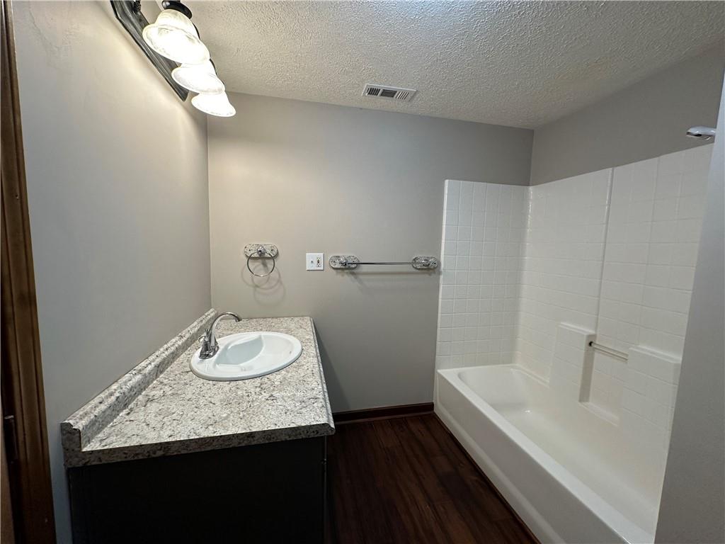 710 Spiva Road Temple, GA 30179 - Photo 24 of 31 a bathroom with a granite countertop sink and a mirror