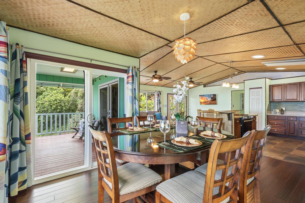 87-2707 Hawaii Belt Road Captain Cook, HI 96704 - Photo 14 of 30 a view of a dining room with furniture window and outside view