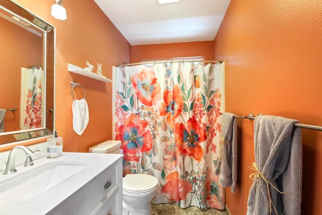 a view of a livingroom with furniture window and wooden floor