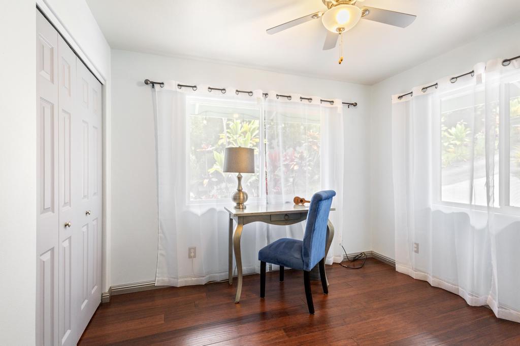87-2707 Hawaii Belt Road Captain Cook, HI 96704 - Photo 22 of 30 a view of a livingroom with furniture window and wooden floor
