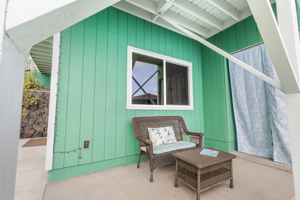 87-2707 Hawaii Belt Road Captain Cook, HI 96704 - Photo 27 of 30 a backyard of a house with table and chairs
