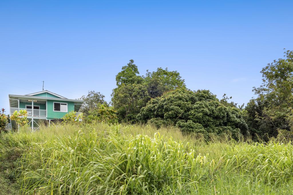 87-2707 Hawaii Belt Road Captain Cook, HI 96704 - Photo 29 of 30 a view of a garden with a house in the background