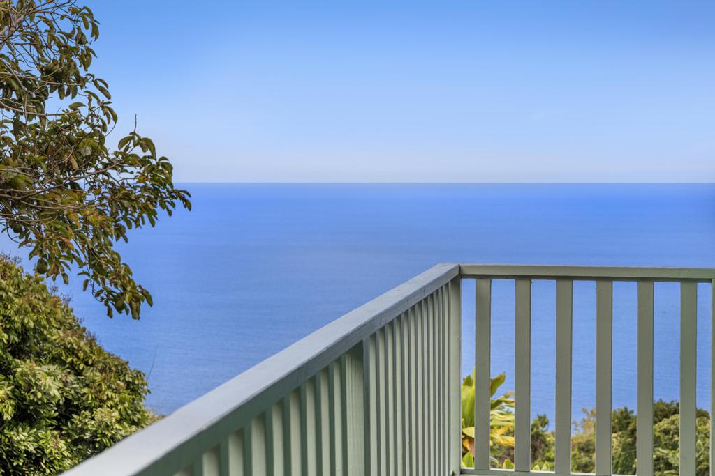 87-2707 Hawaii Belt Road Captain Cook, HI 96704 - Photo 6 of 30 a balcony with a flower garden