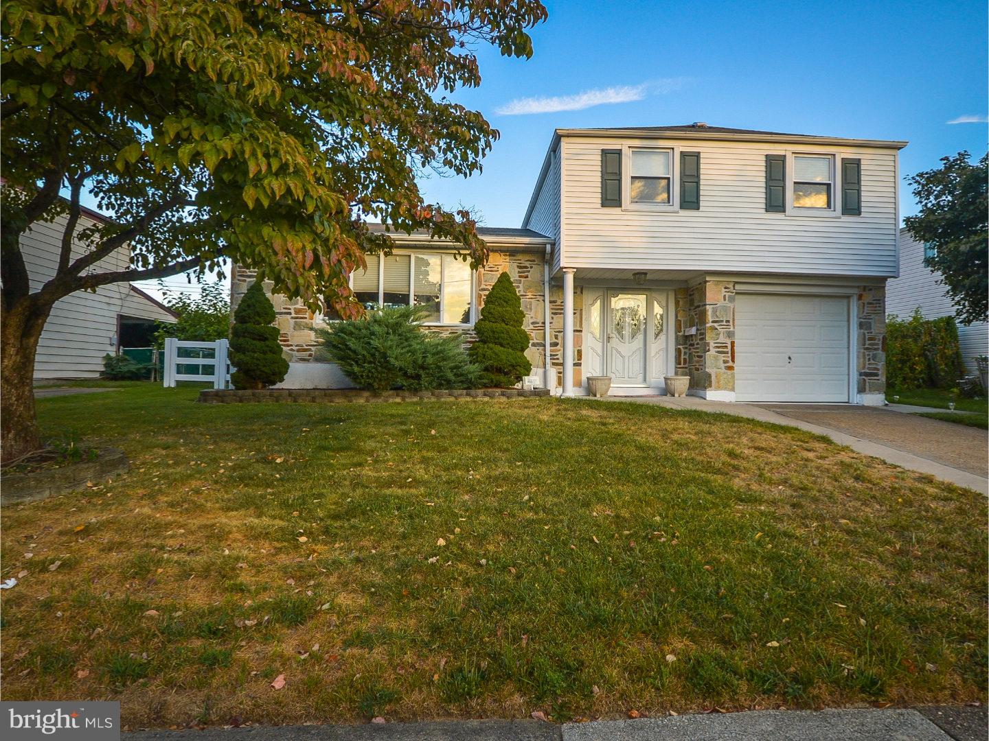 9734 Beacon Road Philadelphia, PA 19115 - Photo 1 of 25 a front view of a house with a yard