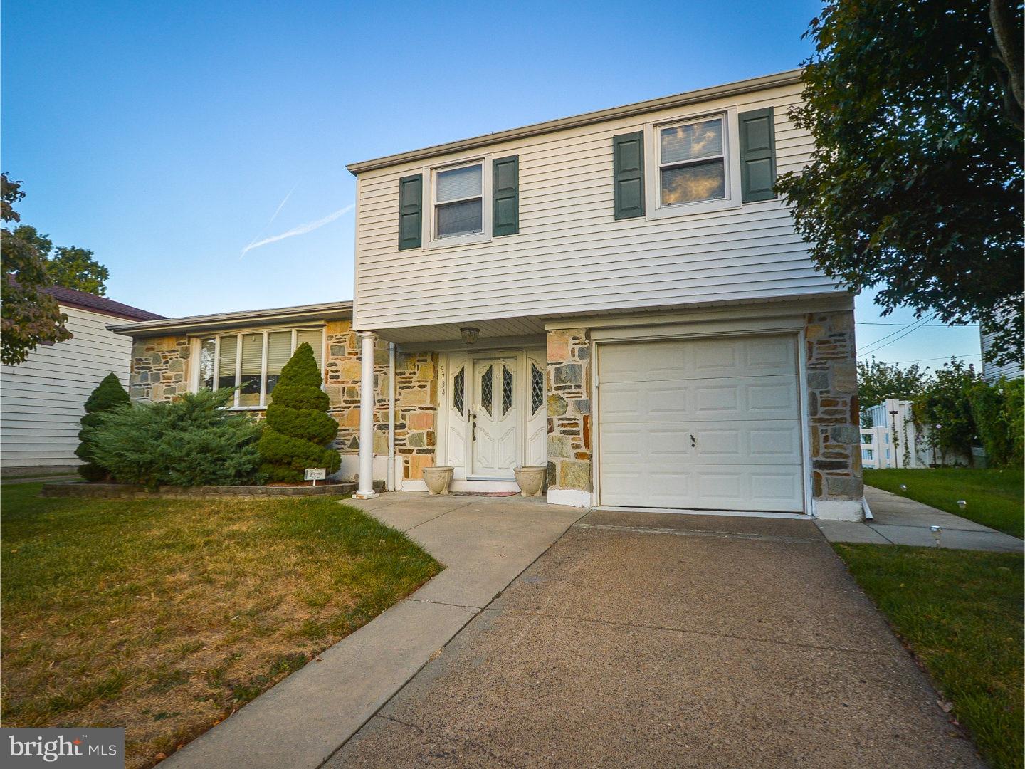 9734 Beacon Road Philadelphia, PA 19115 - Photo 2 of 25 a front view of a house with a yard