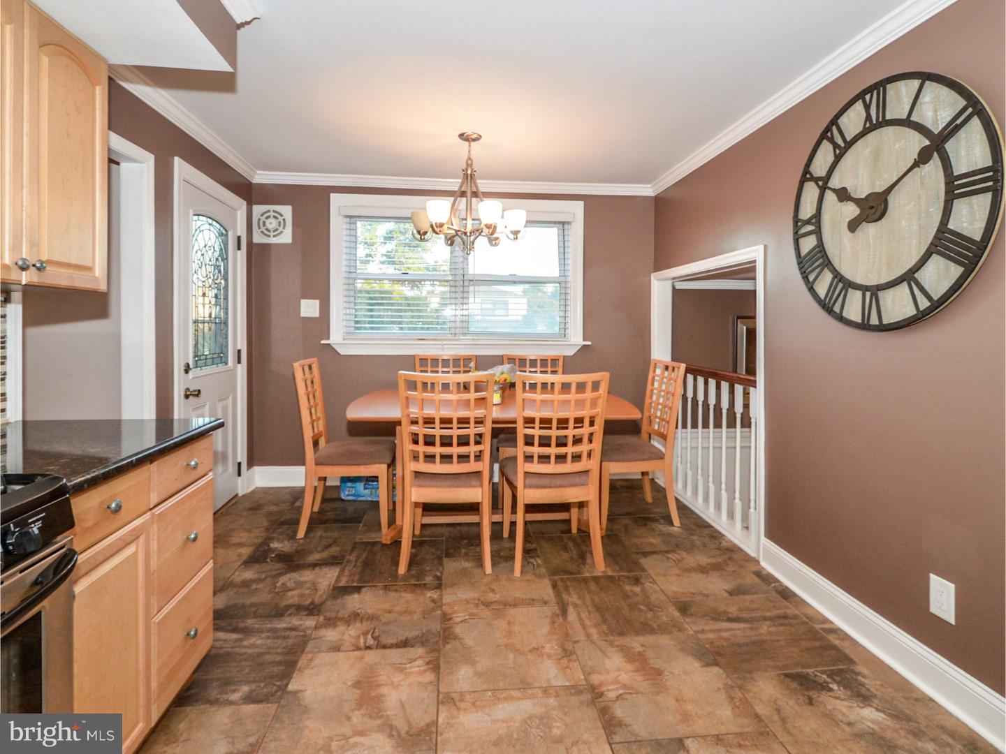 9734 Beacon Road Philadelphia, PA 19115 - Photo 13 of 25 a view of a dining room with furniture window and wooden floor