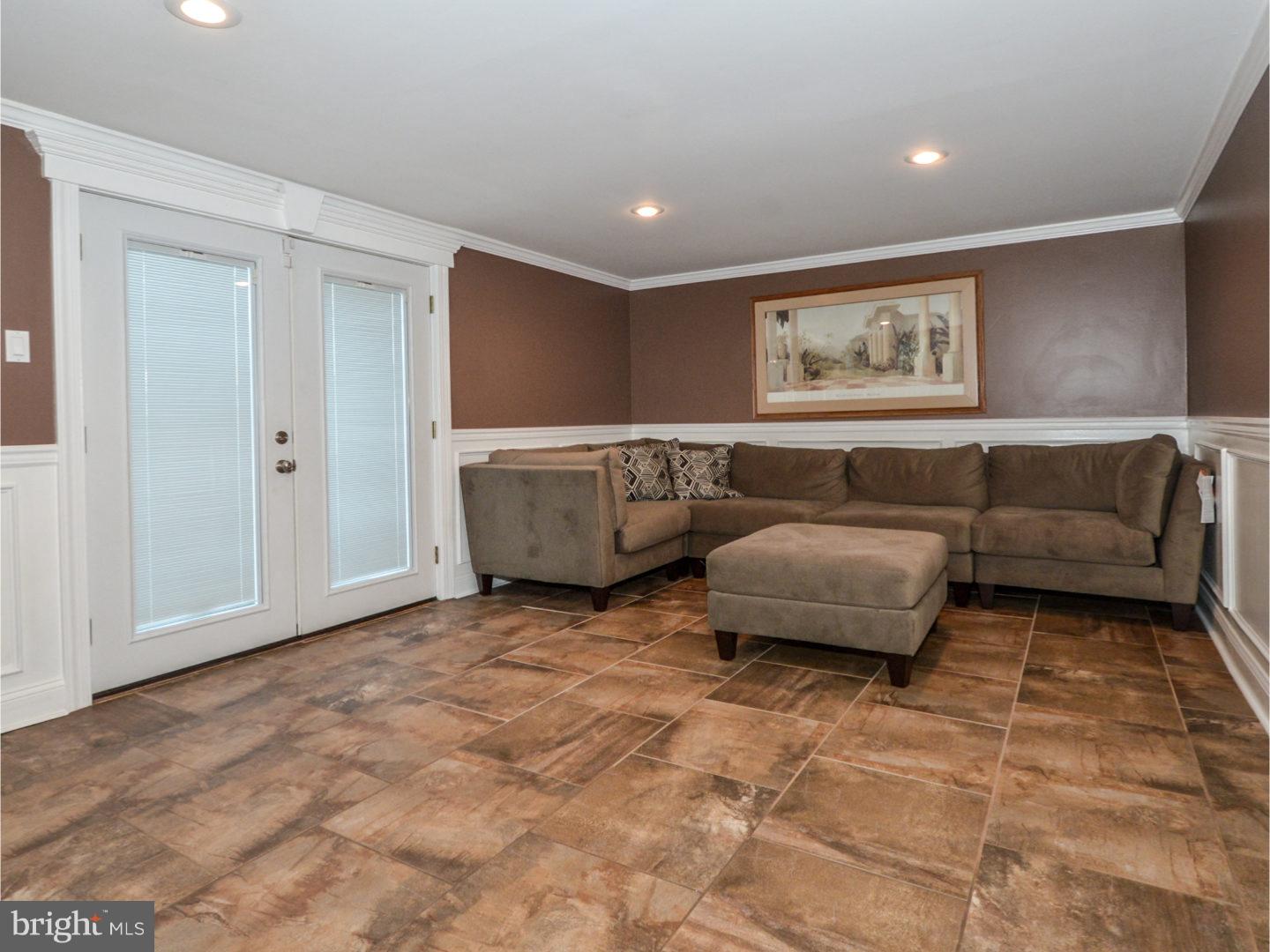 9734 Beacon Road Philadelphia, PA 19115 - Photo 14 of 25 a living room with furniture and a window
