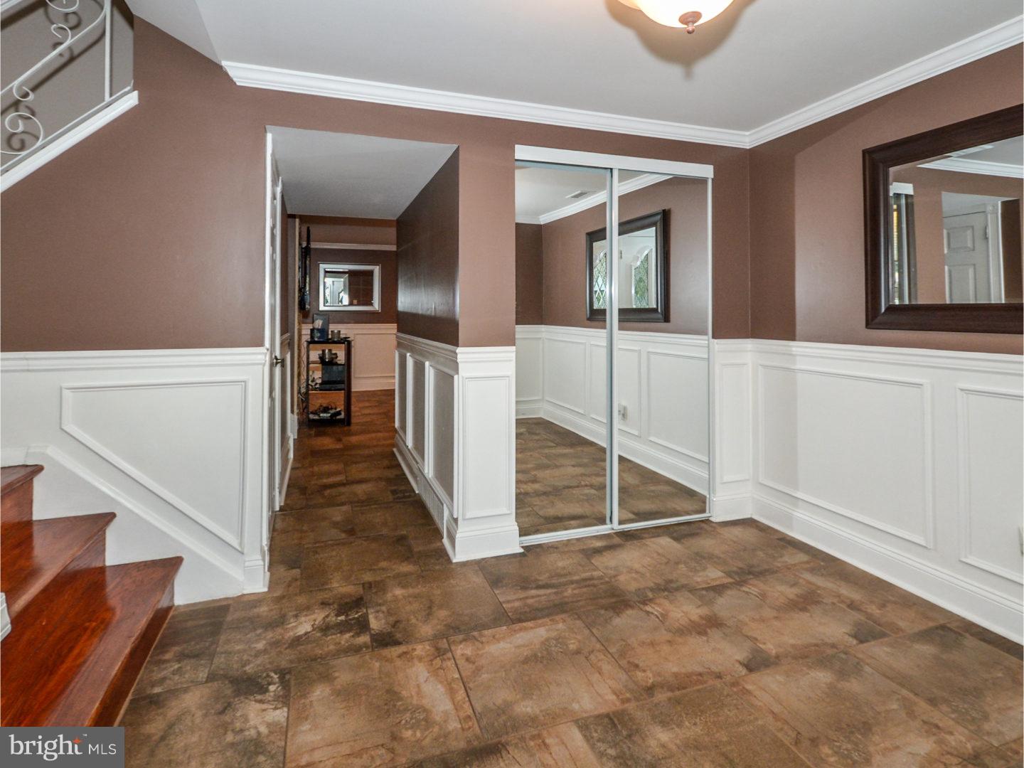 9734 Beacon Road Philadelphia, PA 19115 - Photo 3 of 25 a view of a hallway with staircase and entryway