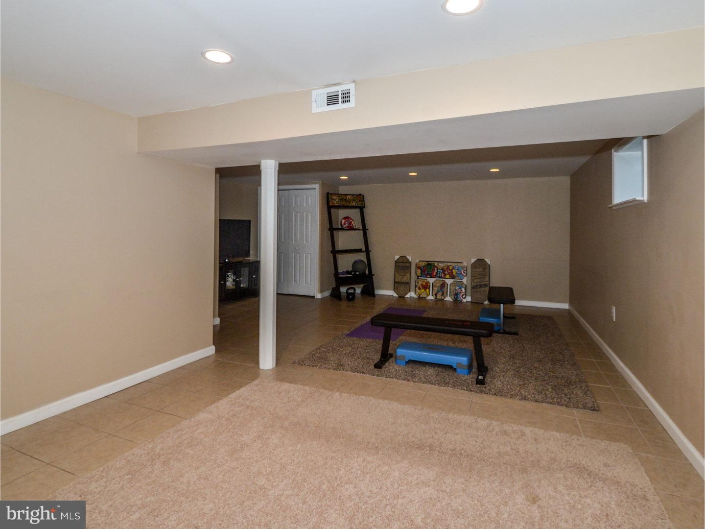 9734 Beacon Road Philadelphia, PA 19115 - Photo 22 of 25 a bedroom with furniture and a chandelier