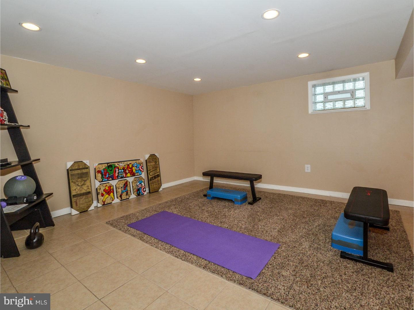 9734 Beacon Road Philadelphia, PA 19115 - Photo 23 of 25 a bedroom with furniture and a wooden floor