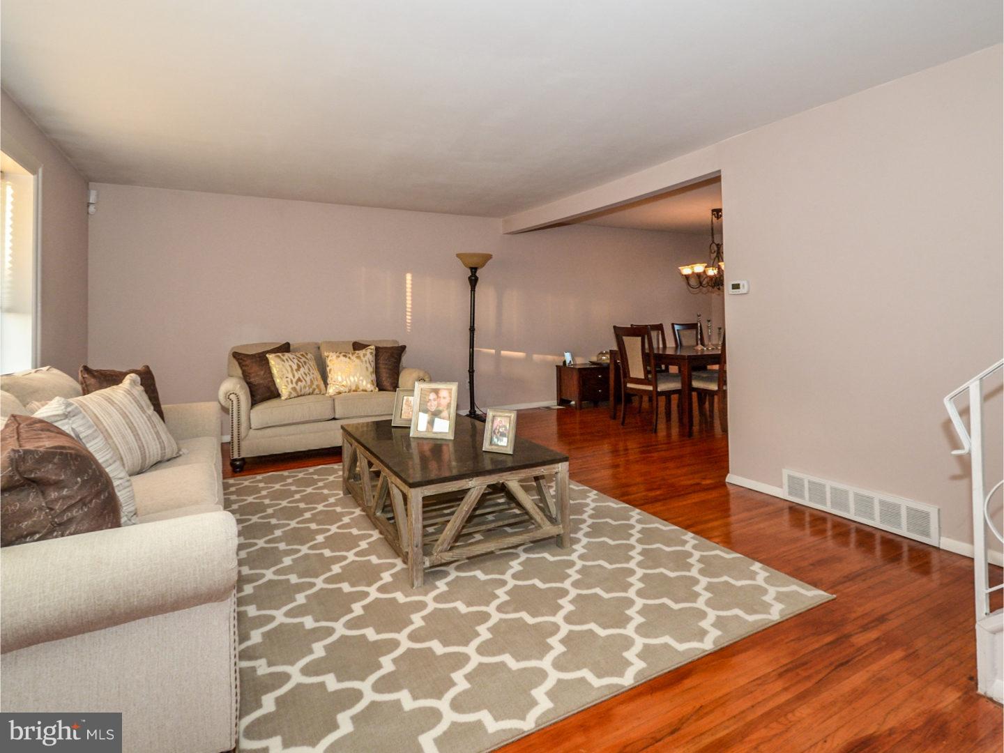 9734 Beacon Road Philadelphia, PA 19115 - Photo 6 of 25 a living room with furniture and a wooden floor
