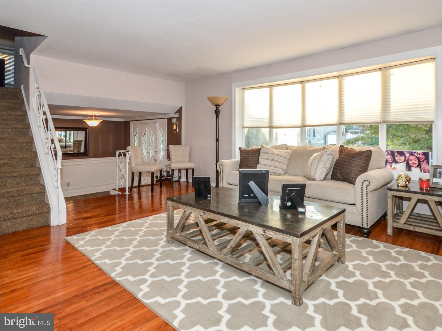 9734 Beacon Road Philadelphia, PA 19115 - Photo 7 of 25 a living room with furniture and a table