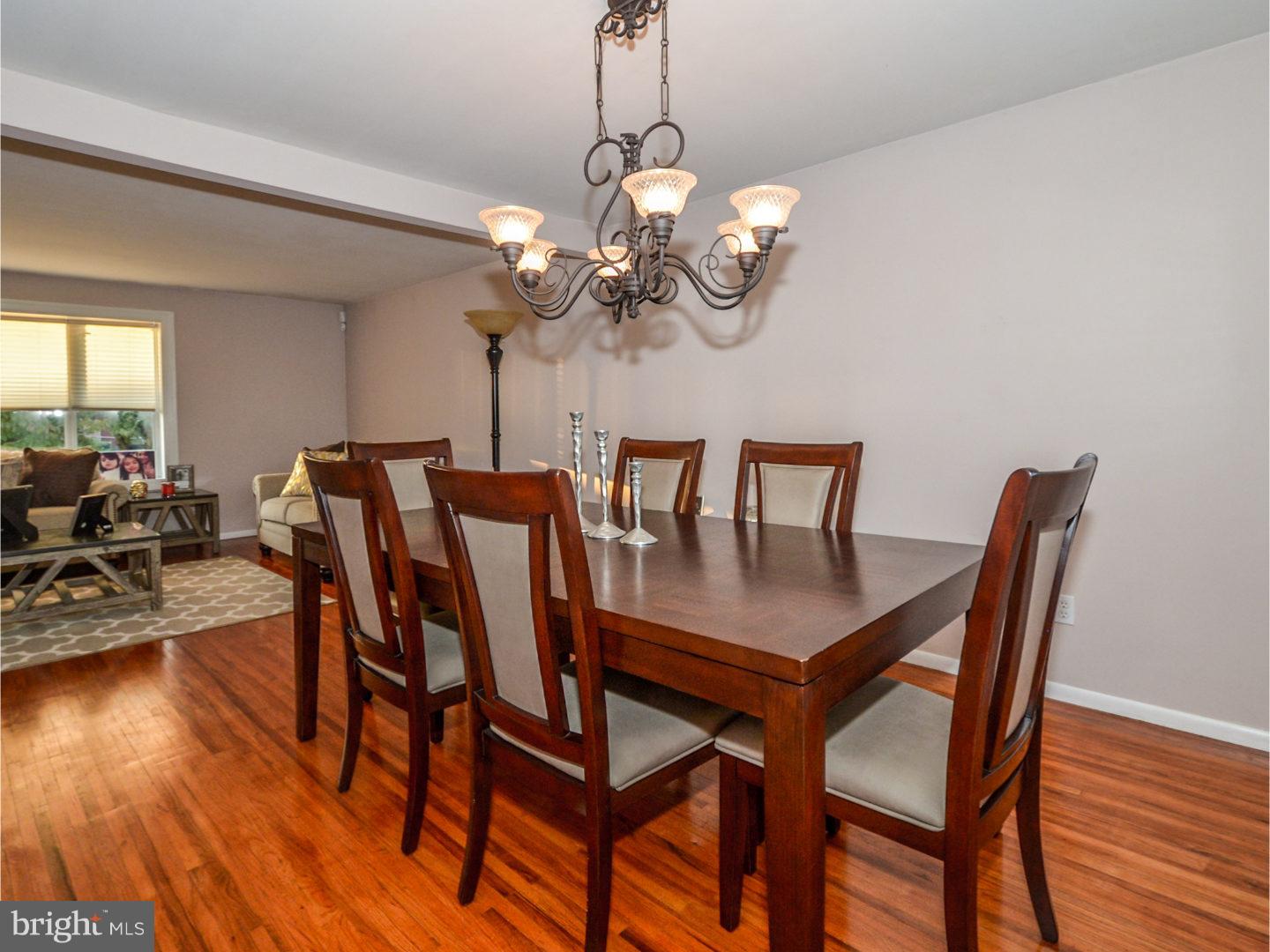 9734 Beacon Road Philadelphia, PA 19115 - Photo 9 of 25 a view of a dining room with furniture wooden floor and chandelier