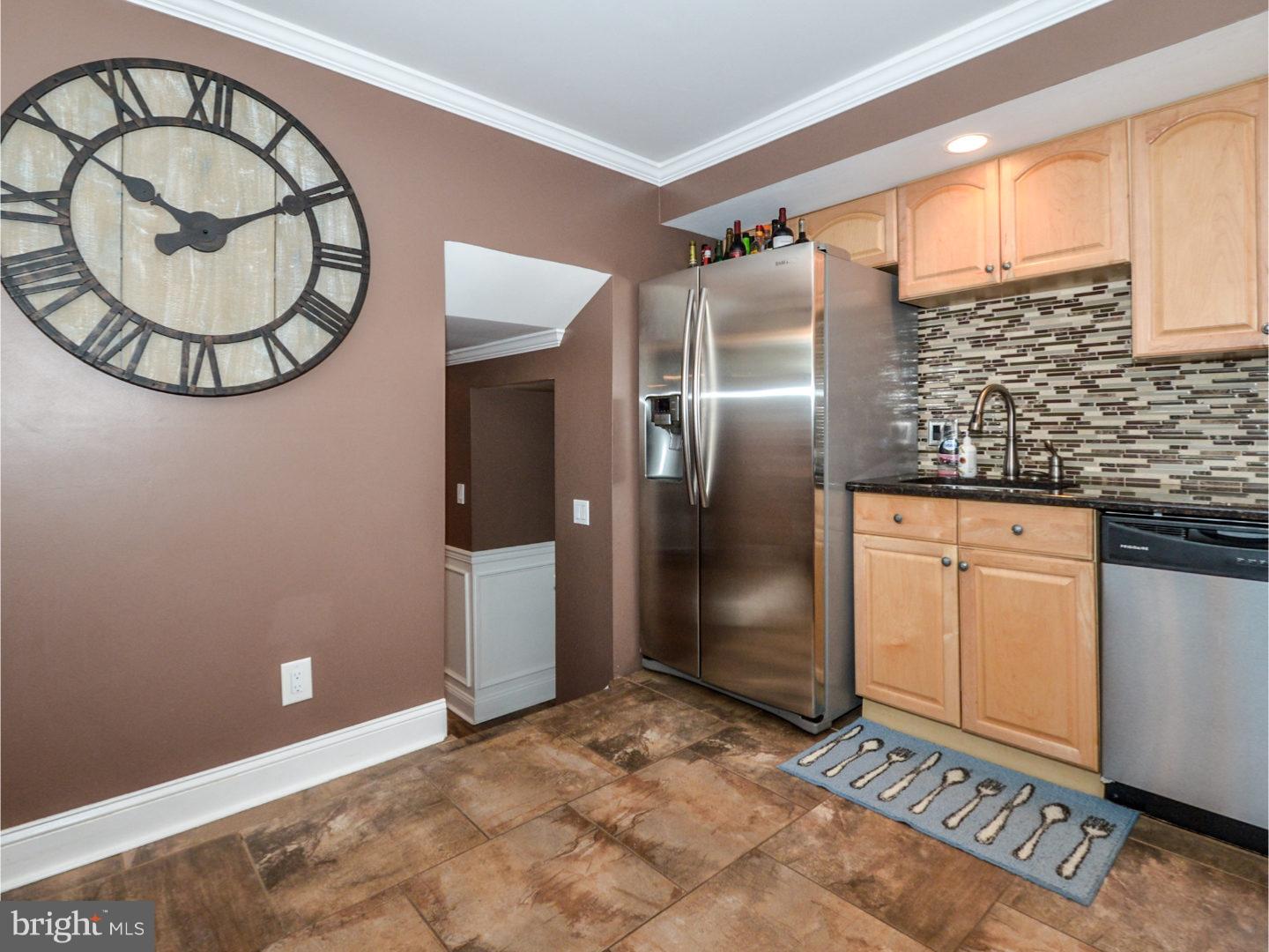 9734 Beacon Road Philadelphia, PA 19115 - Photo 10 of 25 an empty room with wooden floor and white walls