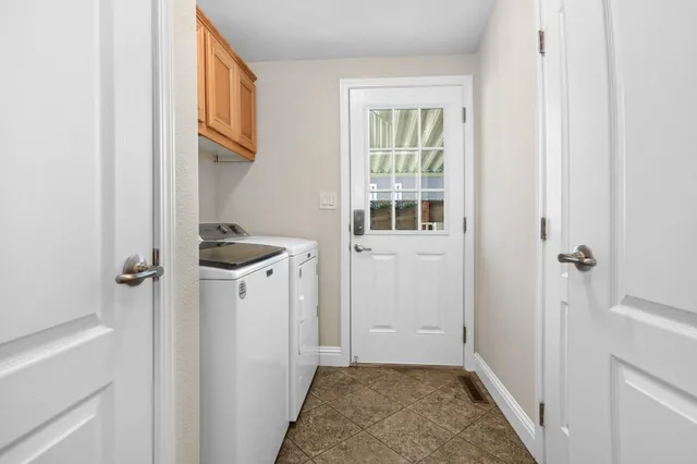 a view of a storage and utility room with a sink