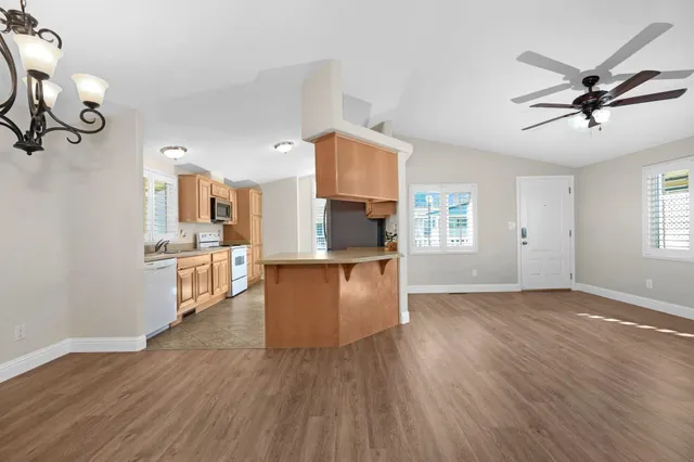 a view of kitchen and dining room with wooden floor