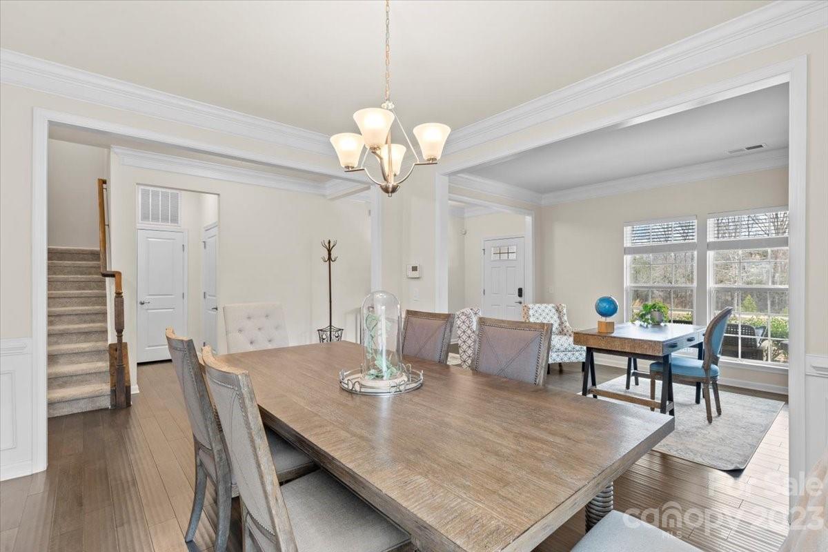 1662 Callahan Road Fort Mill, SC 29715 - Photo 19 of 42 a view of a dining room with furniture wooden floor and chandelier
