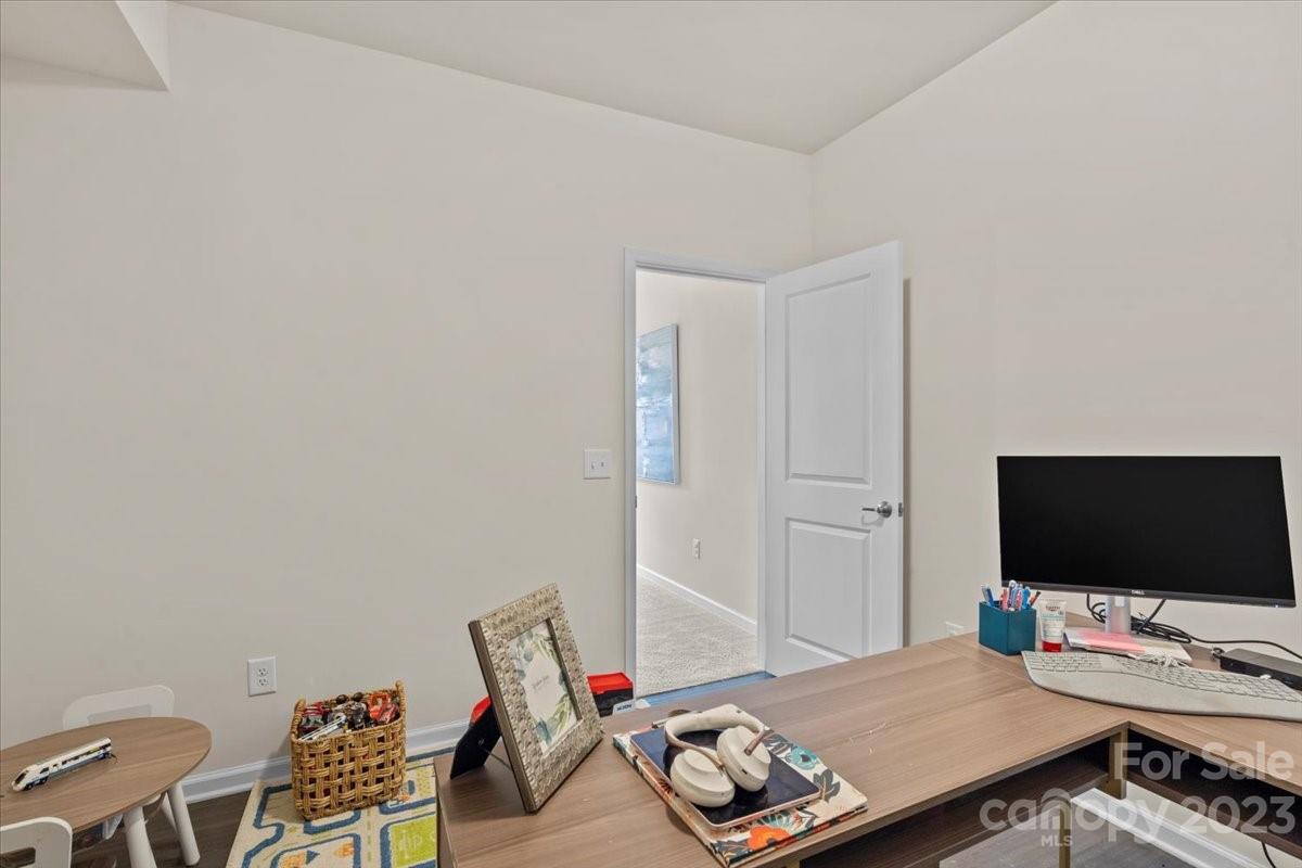 1662 Callahan Road Fort Mill, SC 29715 - Photo 21 of 42 a bedroom with a bed and a flat screen tv