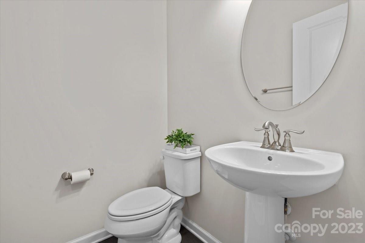 1662 Callahan Road Fort Mill, SC 29715 - Photo 22 of 42 a bathroom with a sink a toilet and a mirror