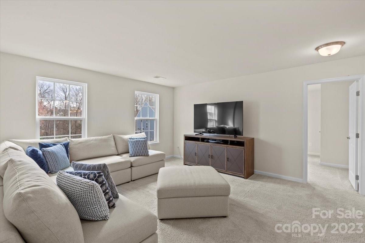 1662 Callahan Road Fort Mill, SC 29715 - Photo 26 of 42 a living room with furniture and a flat screen tv