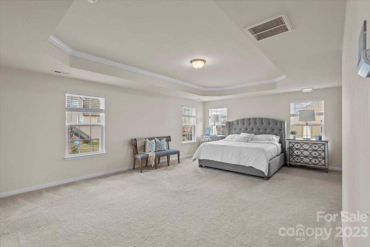 1662 Callahan Road Fort Mill, SC 29715 - Photo 27 of 42 a bedroom with a bed a table and chair