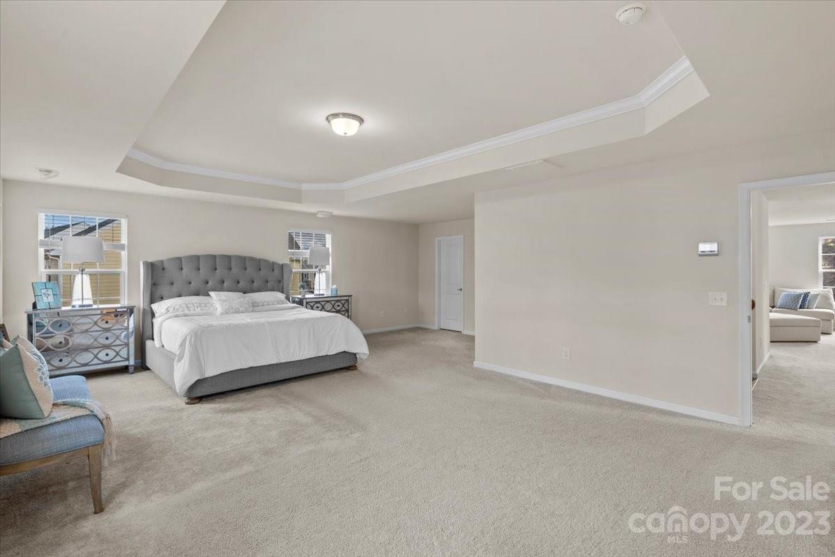 1662 Callahan Road Fort Mill, SC 29715 - Photo 28 of 42 a bedroom with a bed couch and a night stand