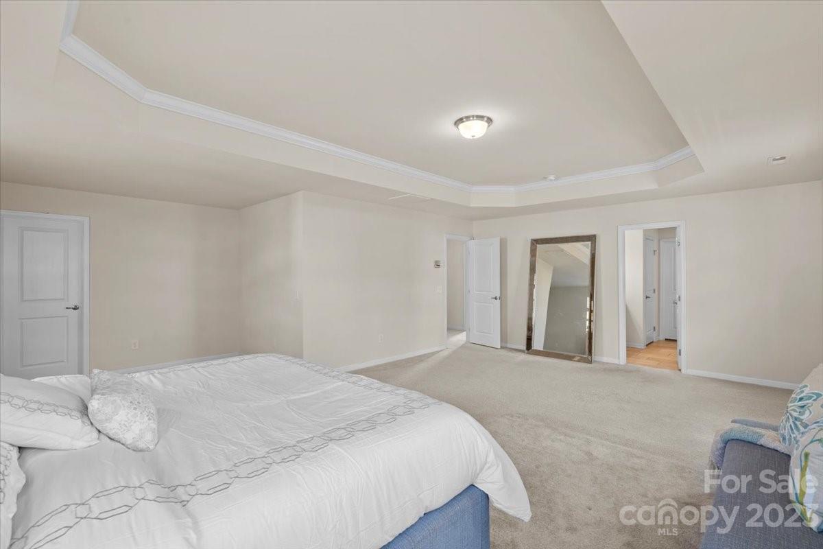 1662 Callahan Road Fort Mill, SC 29715 - Photo 29 of 42 a large white bed in a white room