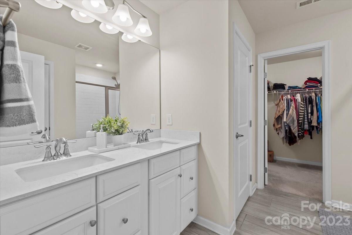 1662 Callahan Road Fort Mill, SC 29715 - Photo 30 of 42 a bathroom with a sink vanity and a mirror
