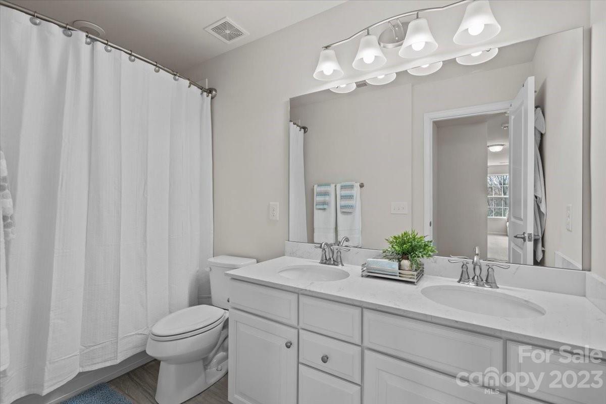 1662 Callahan Road Fort Mill, SC 29715 - Photo 35 of 42 a bathroom with a double vanity sink mirror and toilet