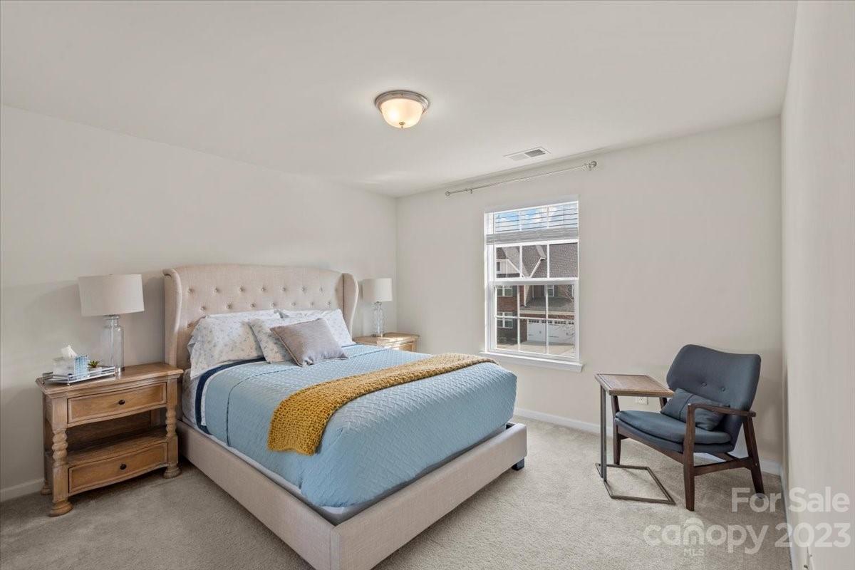 1662 Callahan Road Fort Mill, SC 29715 - Photo 36 of 42 a bedroom with a bed and a chair