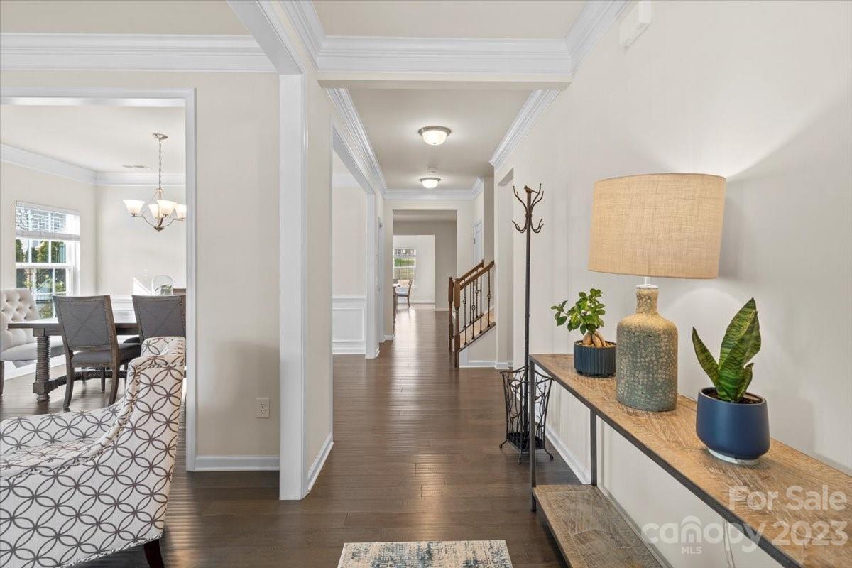1662 Callahan Road Fort Mill, SC 29715 - Photo 5 of 42 a hallway with wooden floor and potted plant