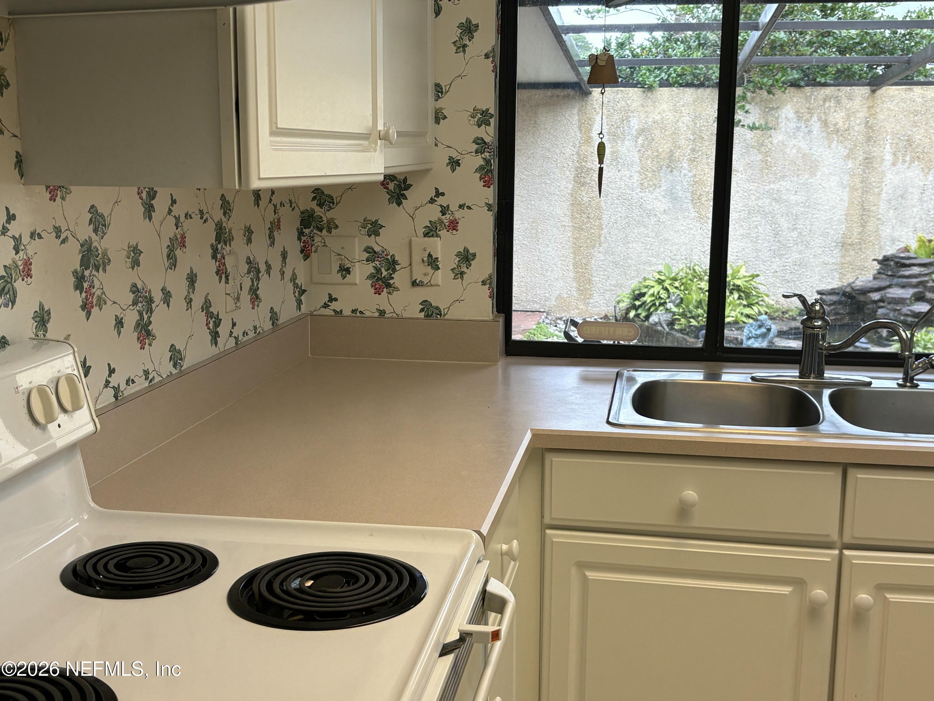 3411 Waverly Dock Road Jacksonville, FL 32223 - Photo 5 of 6 a view of a sink and a microwave