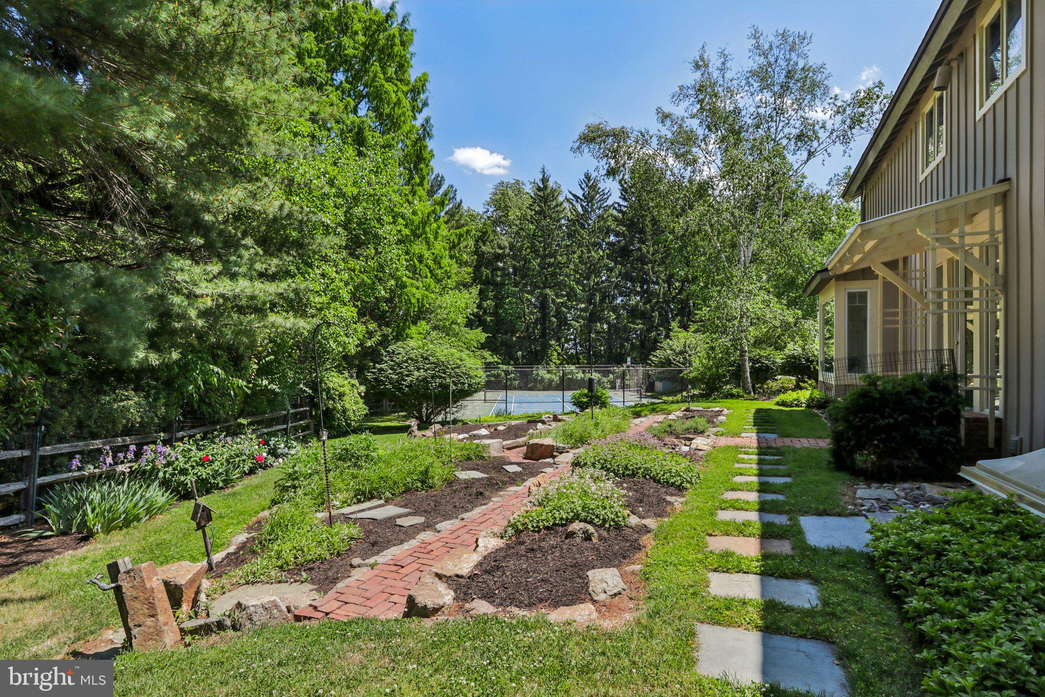 1673 Paper Mill Road Jenkintown, PA 19046 - Photo 70 of 73 a view of yard with small fountain plants and large trees