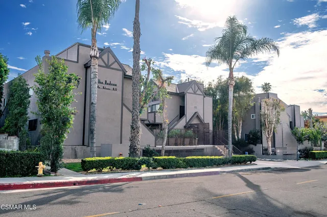 a front view of a building with street view
