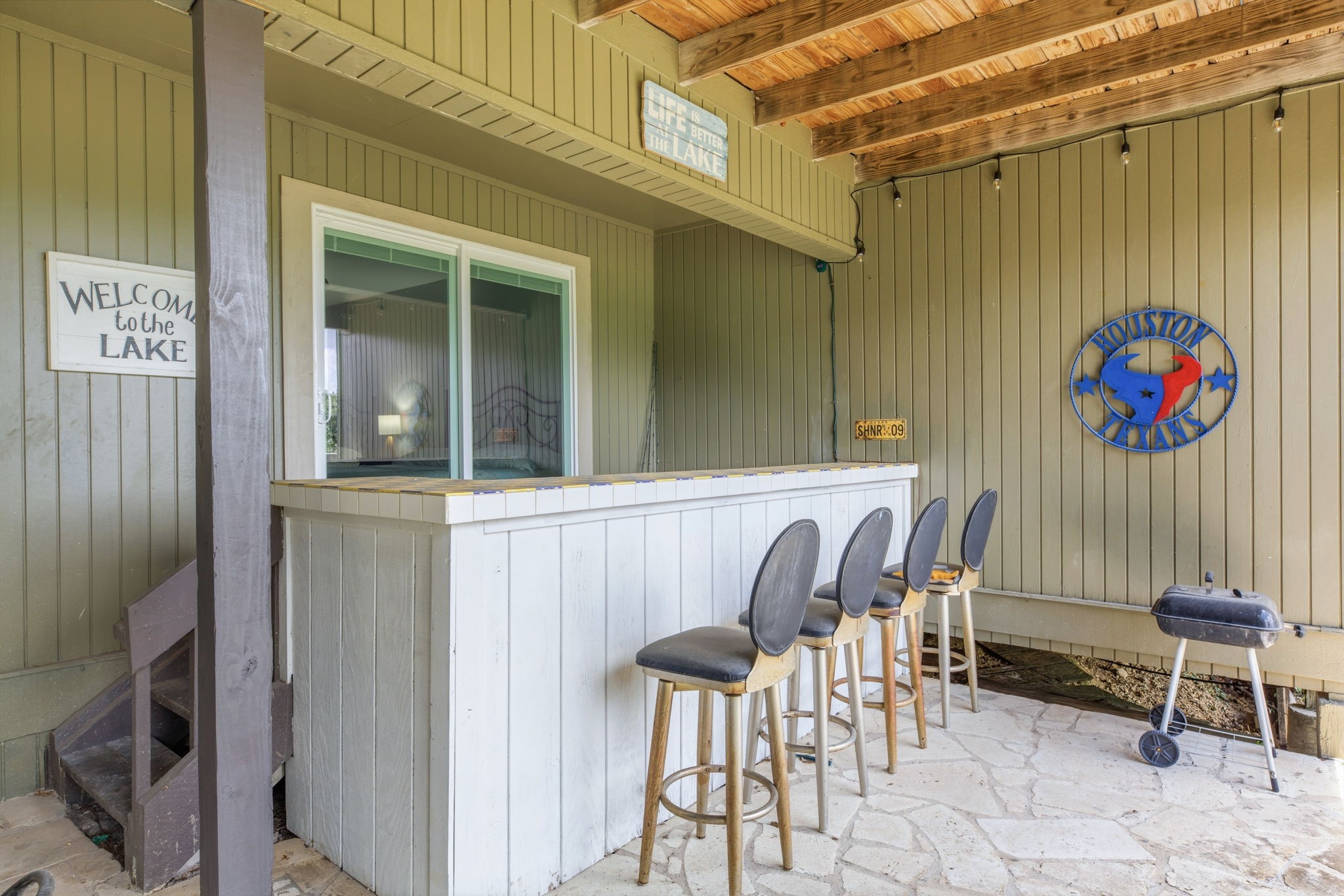 319 Venture Boulevard South Point Venture, TX 78645 - Photo 23 of 25 It's party time on the lower level back deck!