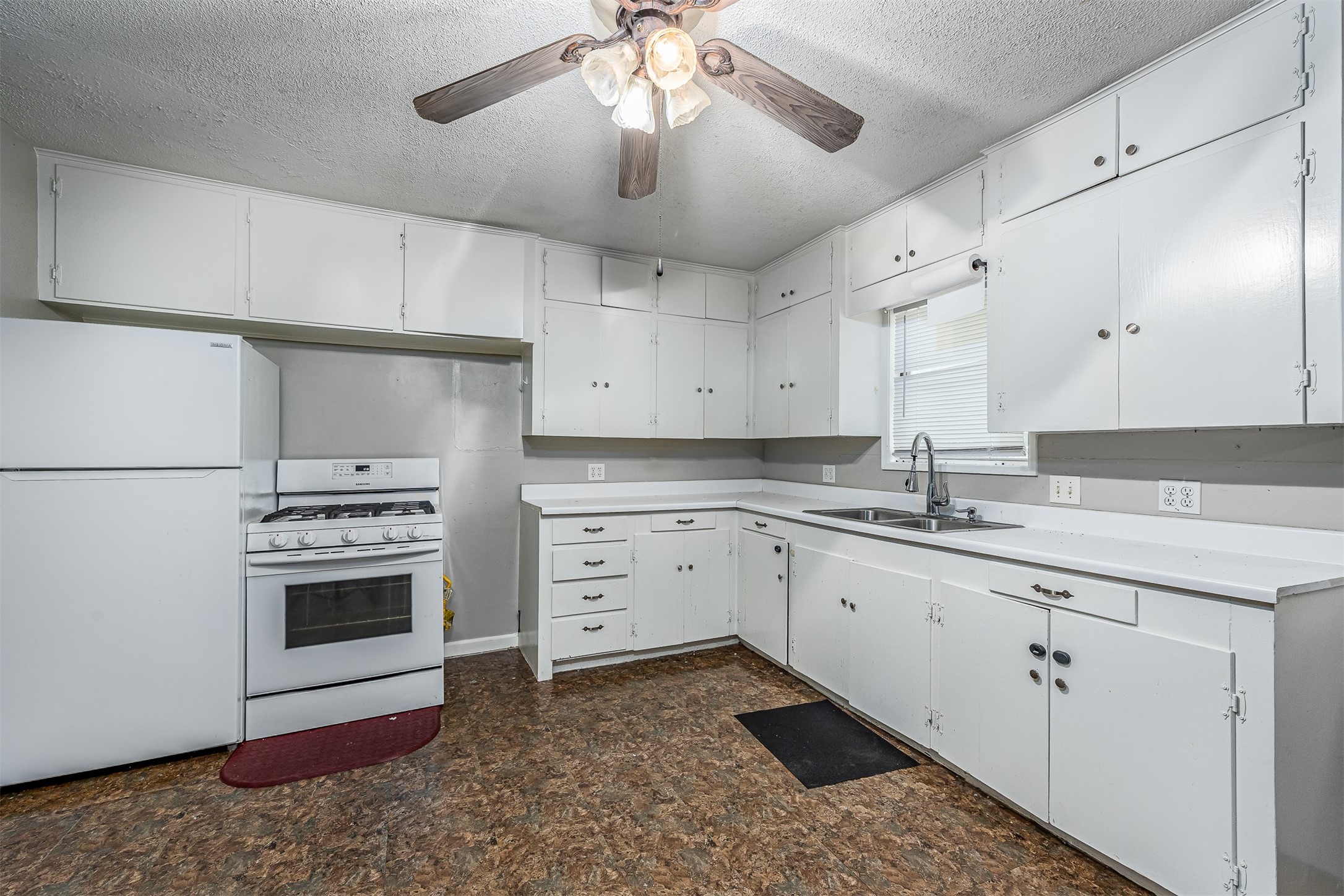 502 Massey Tompkins Road Baytown, TX 77521 - Photo 13 of 32 a kitchen with granite countertop cabinets stainless steel appliances and a chandelier