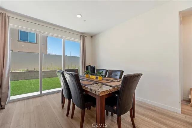 a view of a dining room with furniture and window