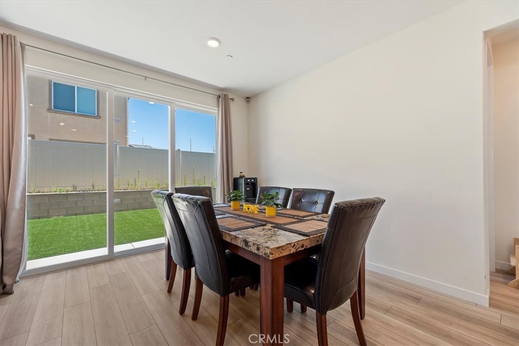 20911 Jennings Way Newhall, CA 91321 - Photo 16 of 47 a view of a dining room with furniture window and wooden floor