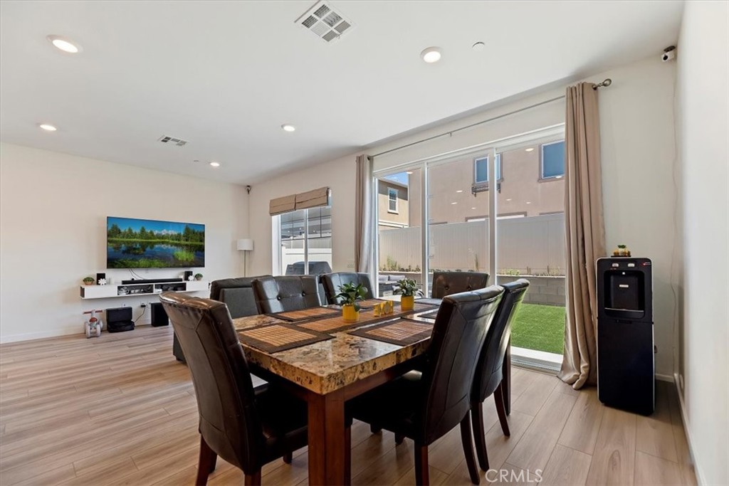 20911 Jennings Way Newhall, CA 91321 - Photo 18 of 47 a view of a dining room with furniture window and wooden floor