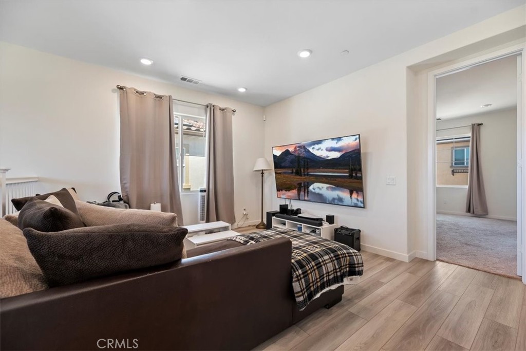 20911 Jennings Way Newhall, CA 91321 - Photo 24 of 47 a bed room with furniture and a flat screen tv