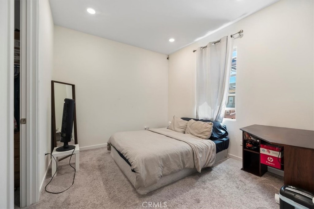 20911 Jennings Way Newhall, CA 91321 - Photo 30 of 47 a bedroom with a bed and a flat tv screen on dresser