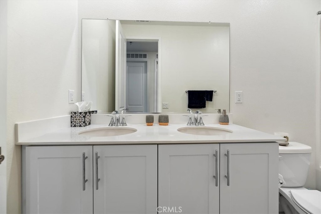20911 Jennings Way Newhall, CA 91321 - Photo 32 of 47 a bathroom with a sink and a mirror